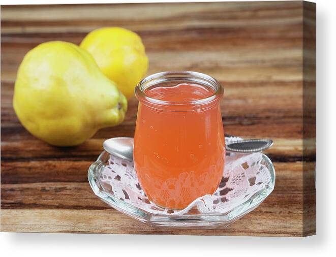 Spoon Canvas Print featuring the photograph Quince Jam In Jar With Fruit, Close Up by Westend61
