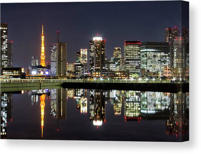 Tokyo Tower Canvas Print featuring the photograph Reflection City Of Tokyo by I Kadek Wismalana