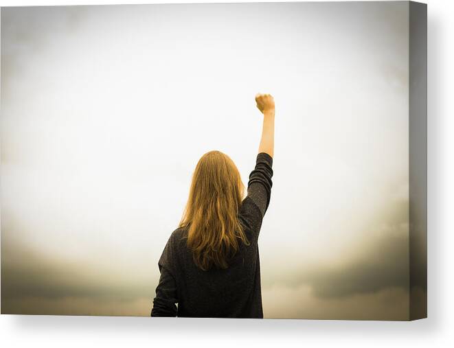 Problems Canvas Print featuring the photograph Revolution fist raised by Christoph Hetzmannseder