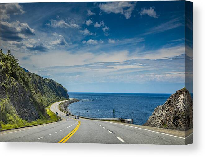 Tranquility Canvas Print featuring the photograph Right by the Saint Lawrence river, a look at beautiful Quebec Route 132, near Cap-au Renard (La Martre) in Haute-Gaspésie, situated in the Eastern part of the Canadian province. by Instants