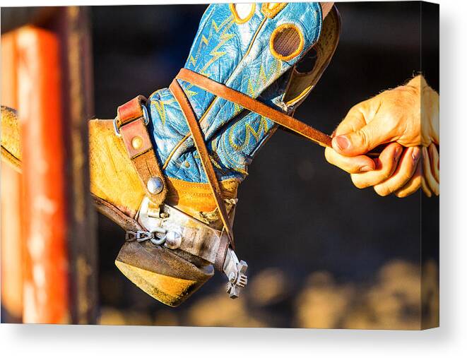 Steven Bateson Canvas Print featuring the photograph Rodeo Boot Tie Down by Steven Bateson