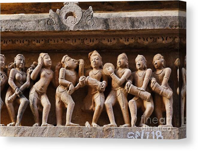 Khajuraho Canvas Print featuring the photograph Sculpture of musicians on the Lakshmana temple at Khajuraho in India by Robert Preston