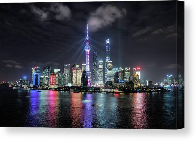 Built Structure Canvas Print featuring the photograph Shanghai Skyline At Night by Martin Puddy