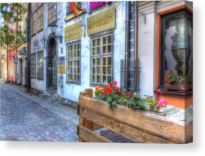 Riga Canvas Print featuring the photograph Shops and Flower Boxes by Claudio Bacinello