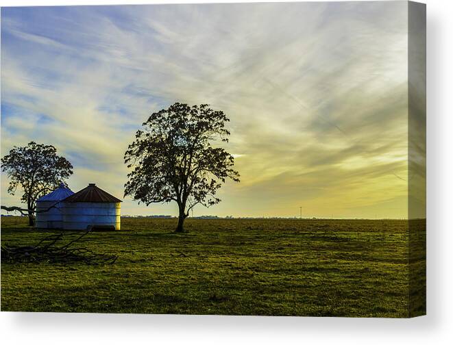 Silos Canvas Print featuring the photograph Silos At Sunset by Spencer Hughes