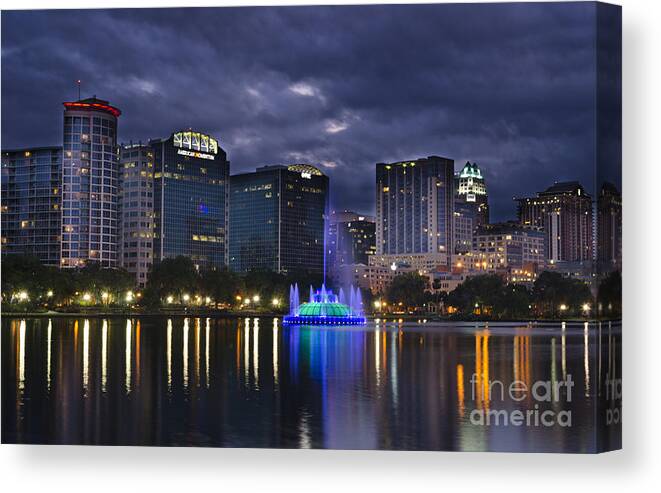 Orlando Canvas Print featuring the photograph Skyline And Fountain At Lake Eola by Bill Bachmann