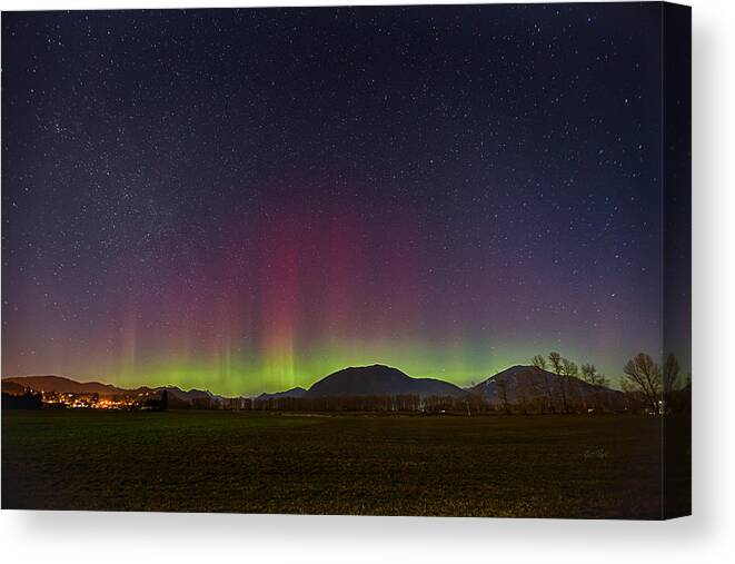 Aurora Canvas Print featuring the photograph Spectacular green-red-magenta Northern lights by Eti Reid