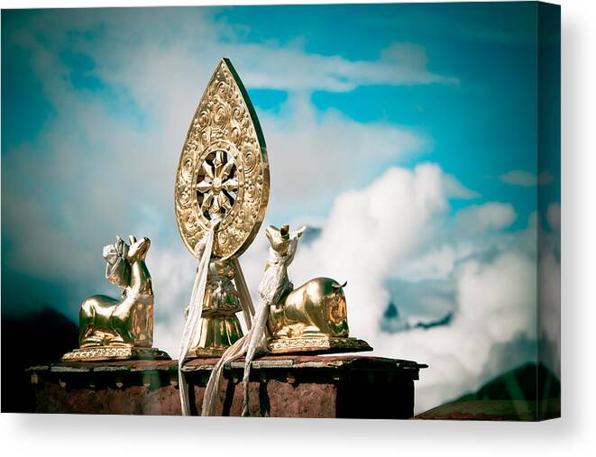 Deer Canvas Print featuring the photograph Stautes Of Deer and Golden Dharma Wheel by Raimond Klavins
