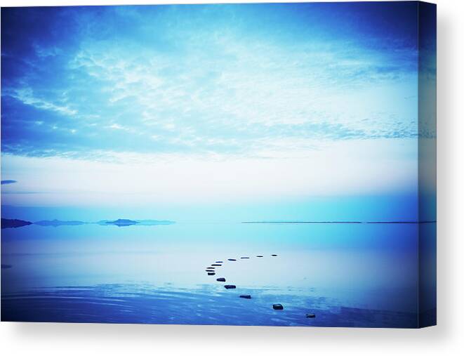 Scenics Canvas Print featuring the photograph Stone Path In Calm Lake At Sunset by Thomas Barwick
