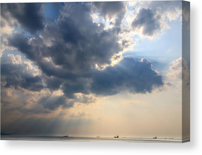 Trieste Canvas Print featuring the photograph Sunrays scattered by clouds over Trieste Bay by Ian Middleton