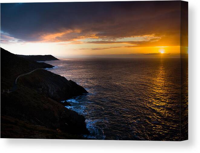 Sunrise Canvas Print featuring the photograph Sunrise over the Wales Coast Path by Paul Cowan