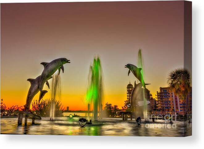 Dolphins Canvas Print featuring the photograph Sunset Dolphins by Marvin Spates
