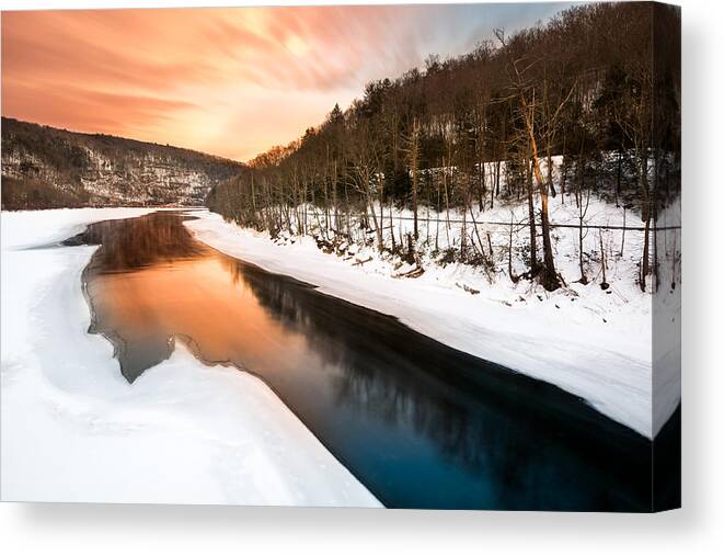 Pond Eddy Canvas Print featuring the photograph Sunset over a frozen Delaware river by Mihai Andritoiu
