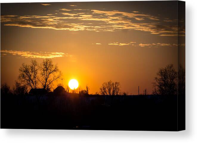 Sunset Canvas Print featuring the photograph Sunset Over the Distant Farm by Holden The Moment
