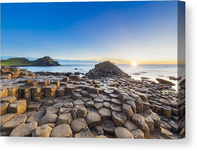 Water's Edge Canvas Print featuring the photograph Sunset over Giants Causeway, Northern Ireland by DieterMeyrl