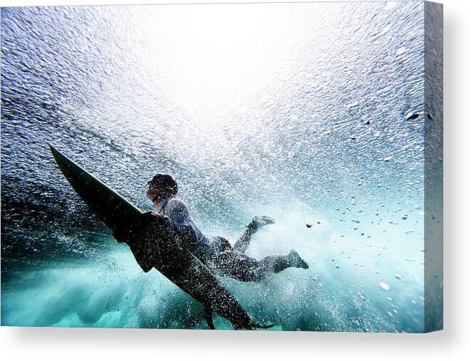 Expertise Canvas Print featuring the photograph Surfer Duck Diving by Subman