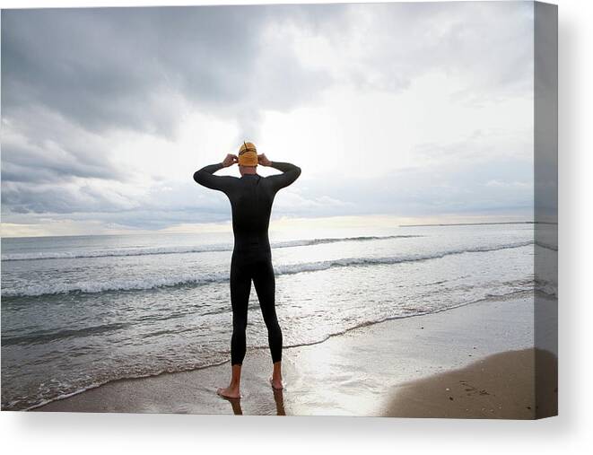 Hands Behind Head Canvas Print featuring the photograph Swimmer On The Beach by (c) Jaime Monfort