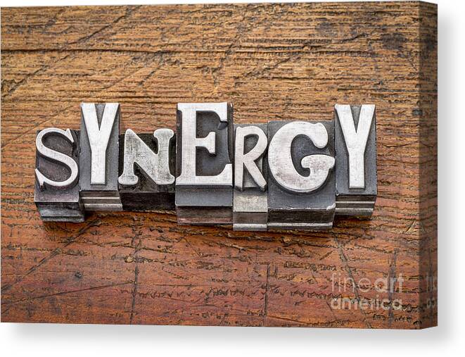 Antique Canvas Print featuring the photograph Synergy Word In Metal Type by Marek Uliasz