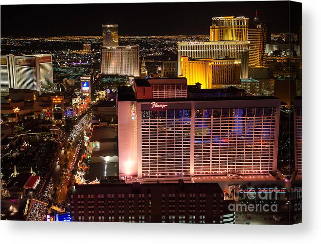 Flamingo Canvas Print featuring the photograph The Flamingo and The Vegas Strip by Eddie Yerkish