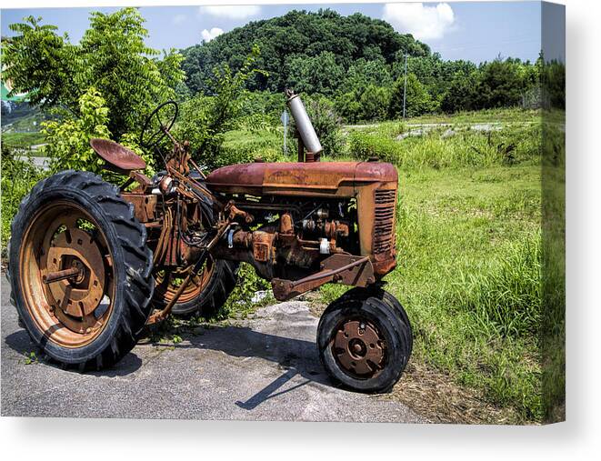 Tractor Canvas Print featuring the photograph The Ghost of Farming Past by Kathy Clark