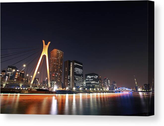 Built Structure Canvas Print featuring the photograph Tokyo Nightview Over Sumida-river by Photography By Zhangxun
