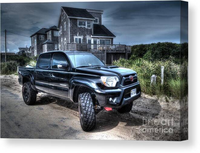 A Brand New Toyota Tacoma Trd Off Road Truck Parked In Front Of Some Beach Houses. Toyota Tacoma Canvas Print featuring the photograph Toyota Tacoma TRD Truck by Robert Loe