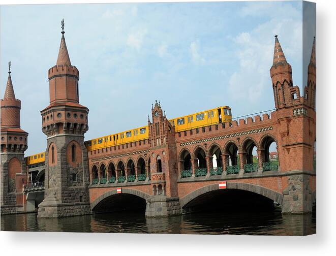 Train Canvas Print featuring the photograph Train Traveling Across A Bridge, Berlin by Riou