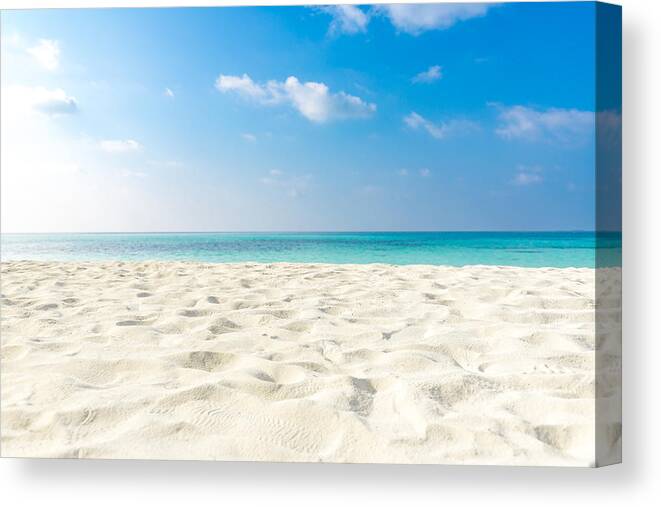 Tranquility Canvas Print featuring the photograph Tropical beach sea sand sky and summer day. Empty sea and beach background with copy space by Levente Bodo