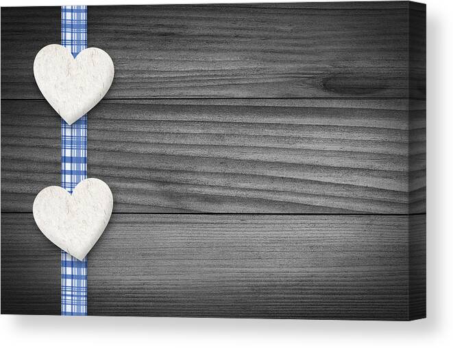Background Canvas Print featuring the photograph Two hearts laying on wood by Aged Pixel