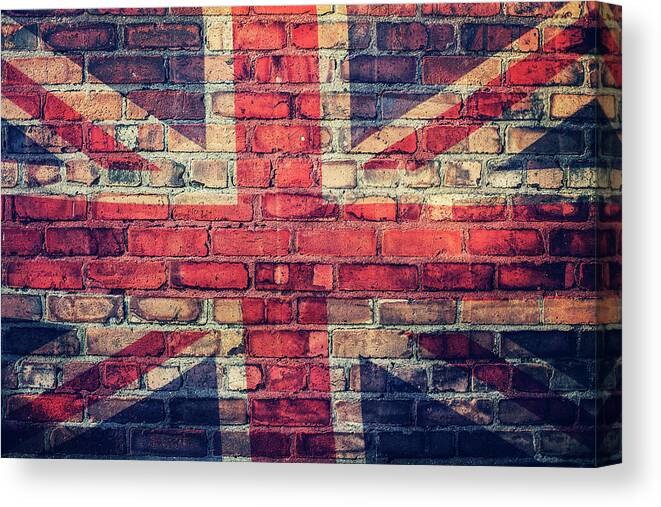 Art Canvas Print featuring the photograph Union Jack Flag On Brick Wall by Sally Anscombe