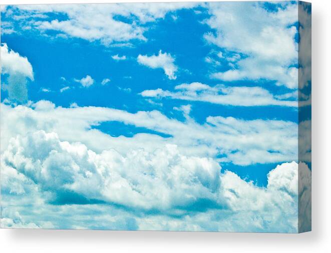 Clouds Canvas Print featuring the photograph Up In The Clear Blue by Rhonda Barrett