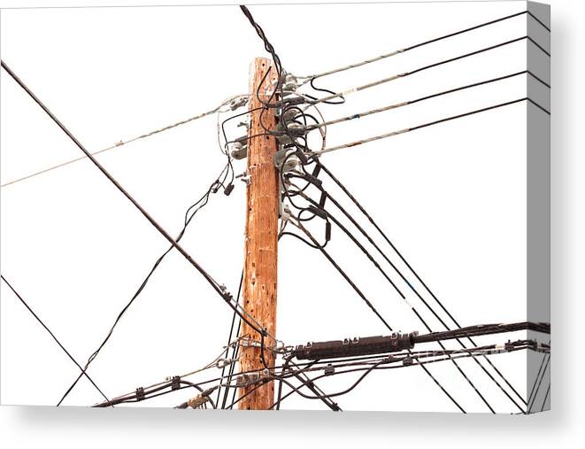Cable Canvas Print featuring the photograph Utility pole hung with electricity power cables by Stephan Pietzko