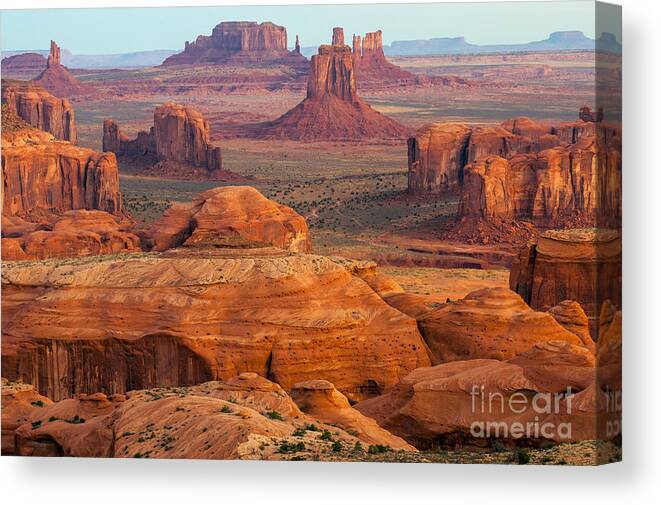 Monument Valley Canvas Print featuring the photograph Valley of Monuments at Dawn by Bob Phillips