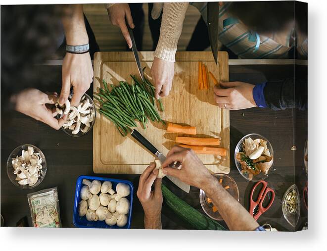 Mid Adult Women Canvas Print featuring the photograph Vegetables being cut in cooking class by Hinterhaus Productions
