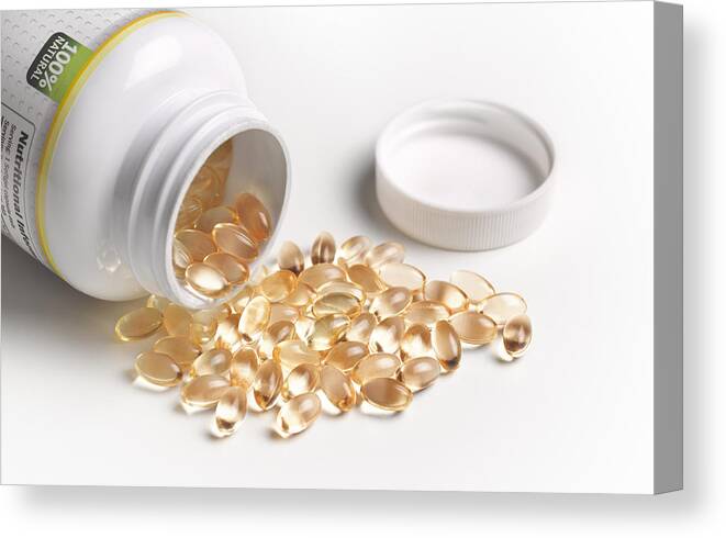 Relief Canvas Print featuring the photograph Vitamin D capsules tablets by Peter Dazeley