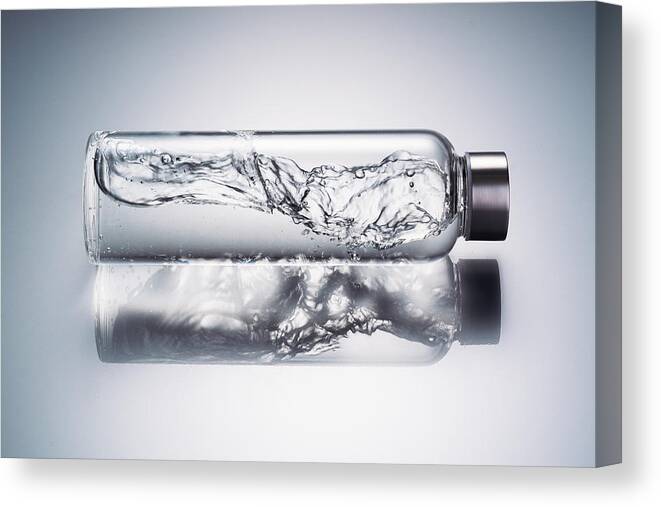 Headwear Canvas Print featuring the photograph Water Wave in Glass Bottle by MirageC