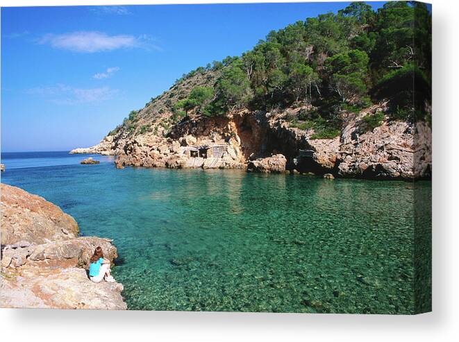 Shadow Canvas Print featuring the photograph Waters Of Cala Xucla With Girl On Rocks by David C Tomlinson