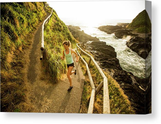 Curve Canvas Print featuring the photograph Woman Running For Exercise by Jordan Siemens