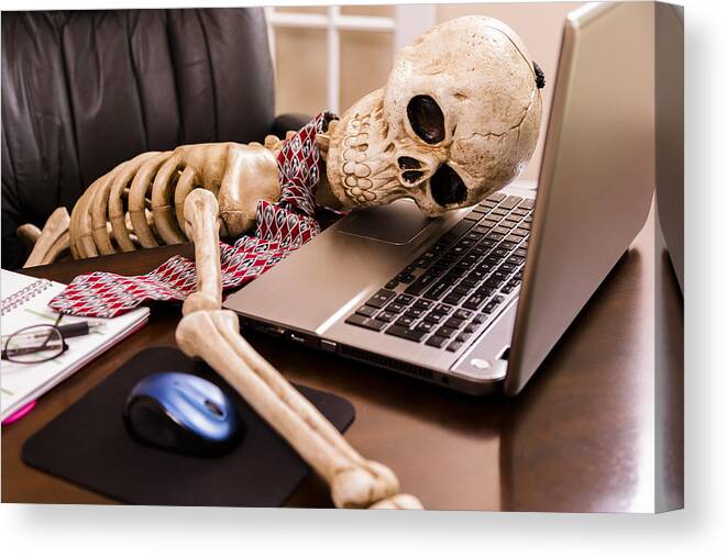 Working Canvas Print featuring the photograph Working to death. Business man's skeleton using laptop in office. by Fstop123