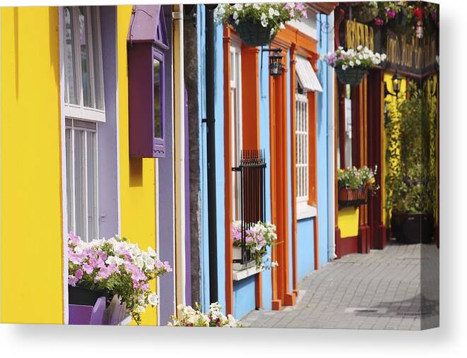 Buildings Canvas Print featuring the photograph Painted Buildings On Main Street In #1 by Trish Punch