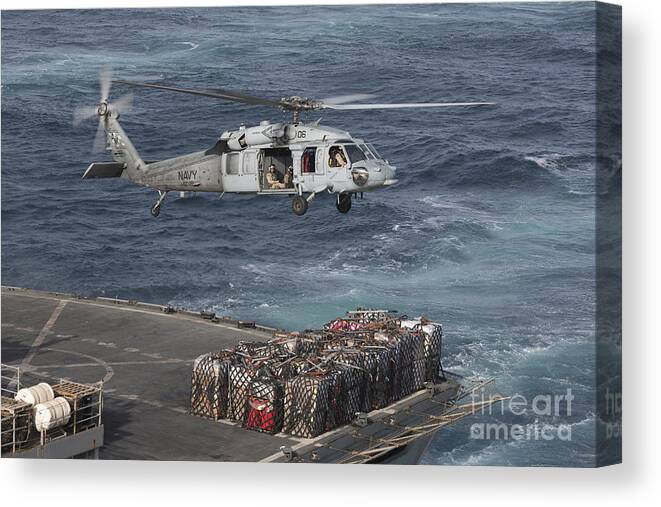 Arabian Sea Canvas Print featuring the photograph A Mh-60s Knighthawk Conducts A Vertical #2 by Gert Kromhout