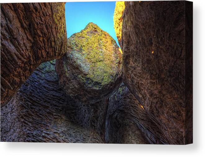 Light Canvas Print featuring the photograph A Rock Balanced Precariously by Robert Postma