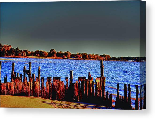 Pier Canvas Print featuring the photograph A Storm in the Sun by Kelly Reber