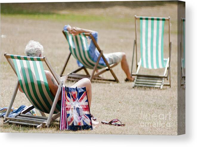 Britain Canvas Print featuring the photograph British Deck chairs by Andrew Michael