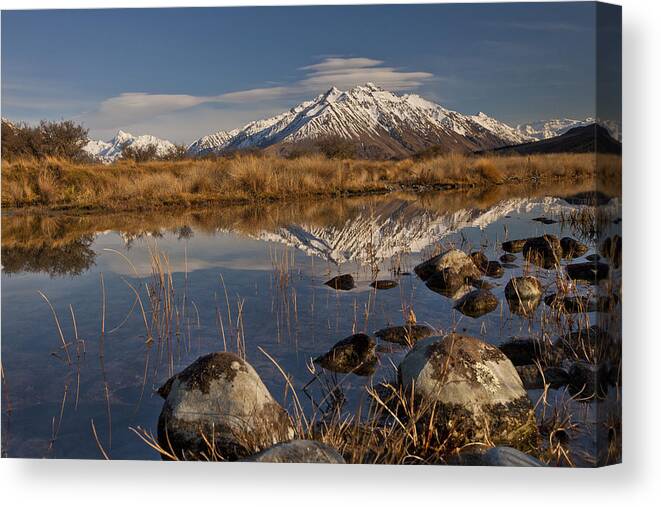 Hhh Canvas Print featuring the photograph Erwhon Station Reflection In Branch by Colin Monteath