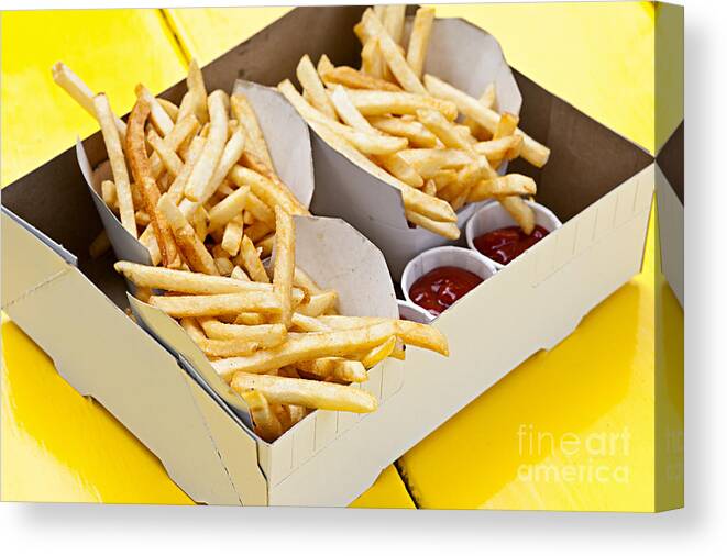 Fries Canvas Print featuring the photograph French fries in box by Elena Elisseeva
