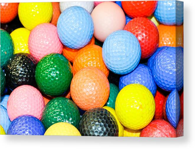 Abundant Canvas Print featuring the photograph Golf balls by Tom Gowanlock