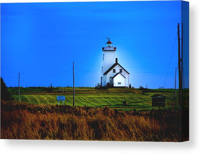 Landscape Canvas Print featuring the photograph Lighthouse in Darkness by Rick Bragan