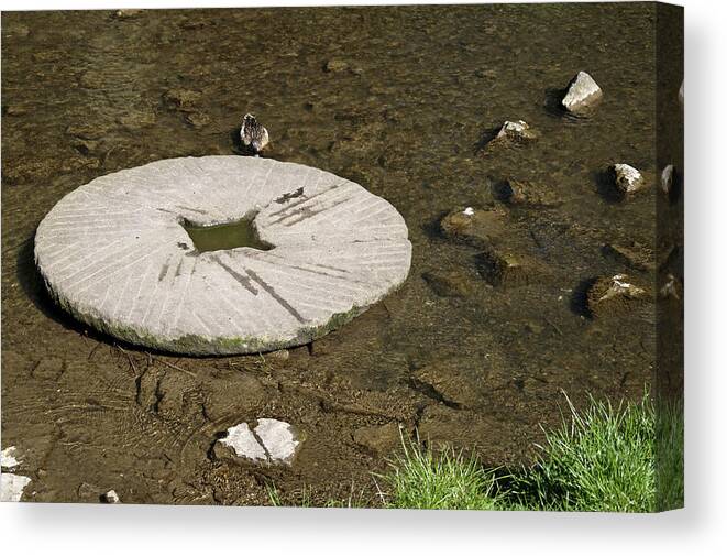 Britain Canvas Print featuring the photograph Millstone in the River Dove - Milldale by Rod Johnson