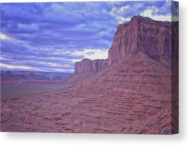 Monument Valley Arizona Canvas Print featuring the photograph Monument Valley Glow by Tom Singleton
